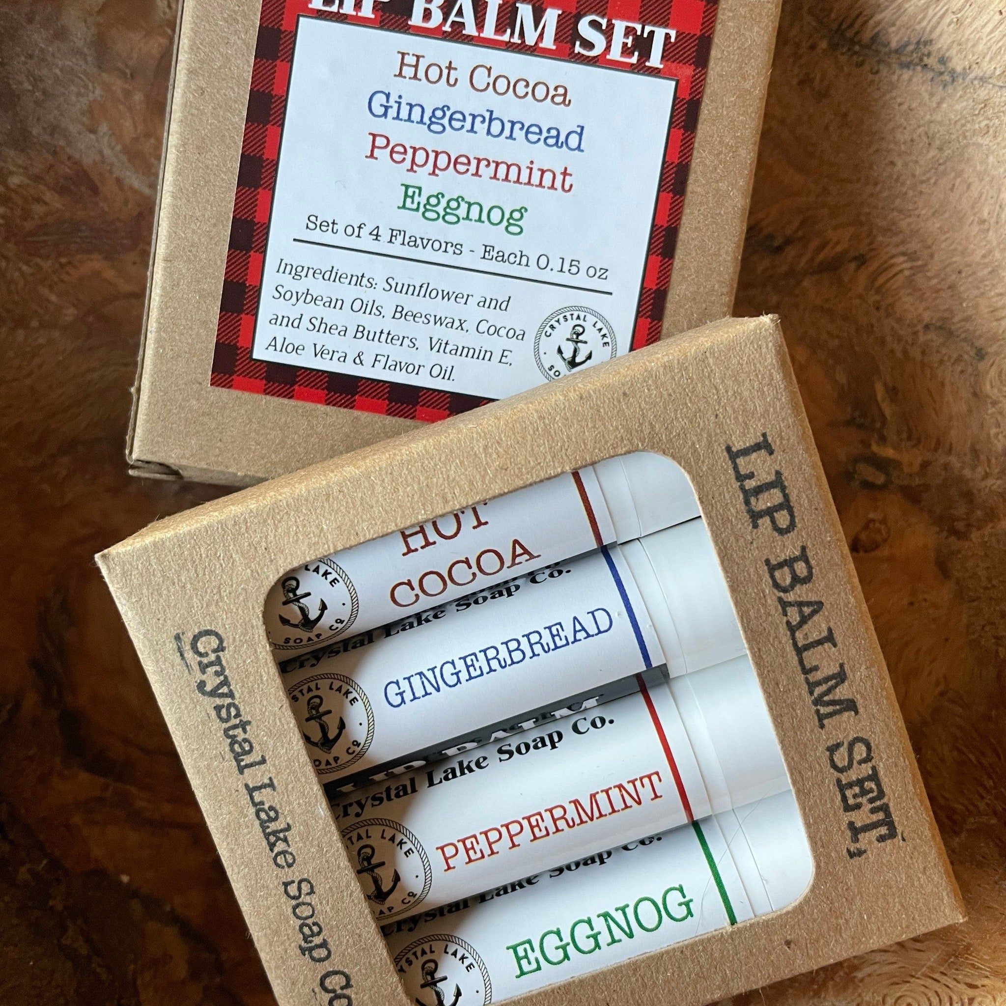 Lip balm gift set in cardboard box with white tubes, Crystal Lake Soap Co. branding, and colored text labels