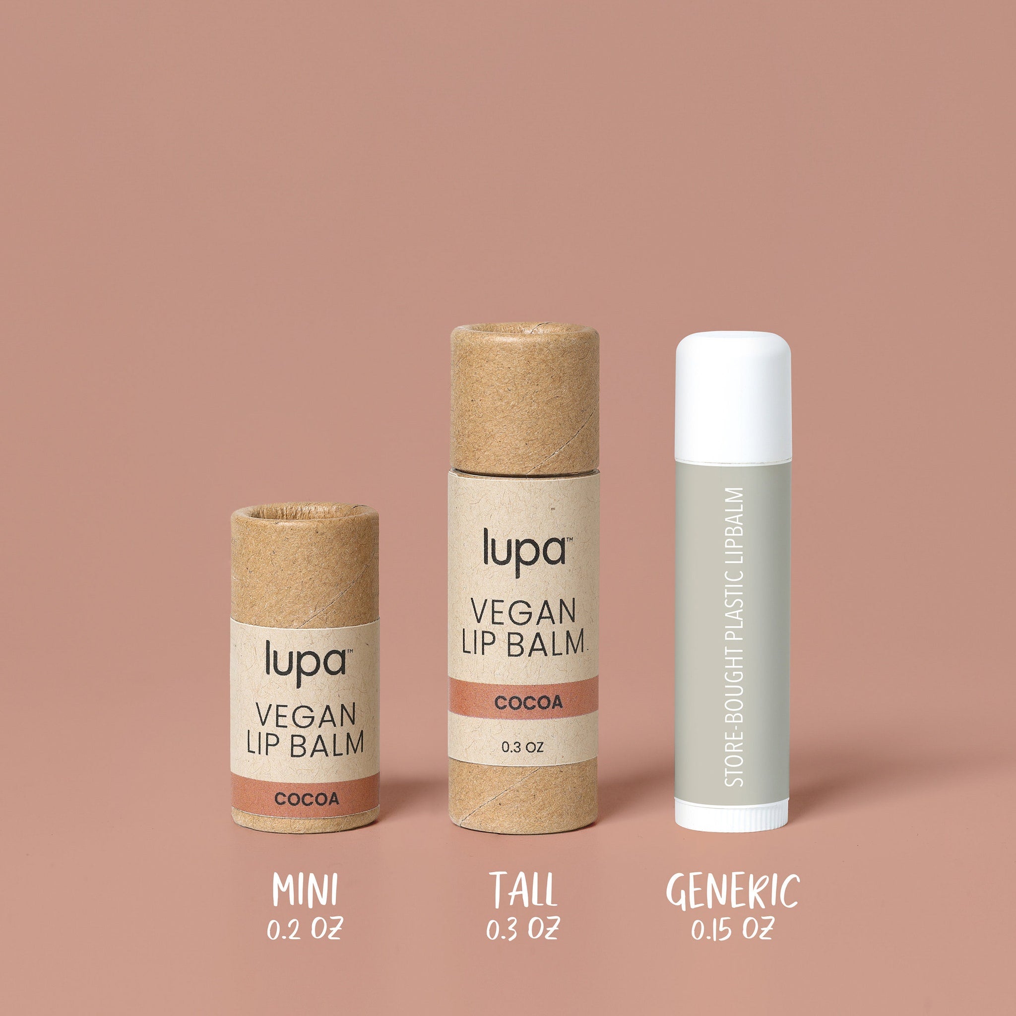 Lip balm tubes in brown cardboard, white plastic, and gray plastic, with Lupa branding and "Cocoa" text