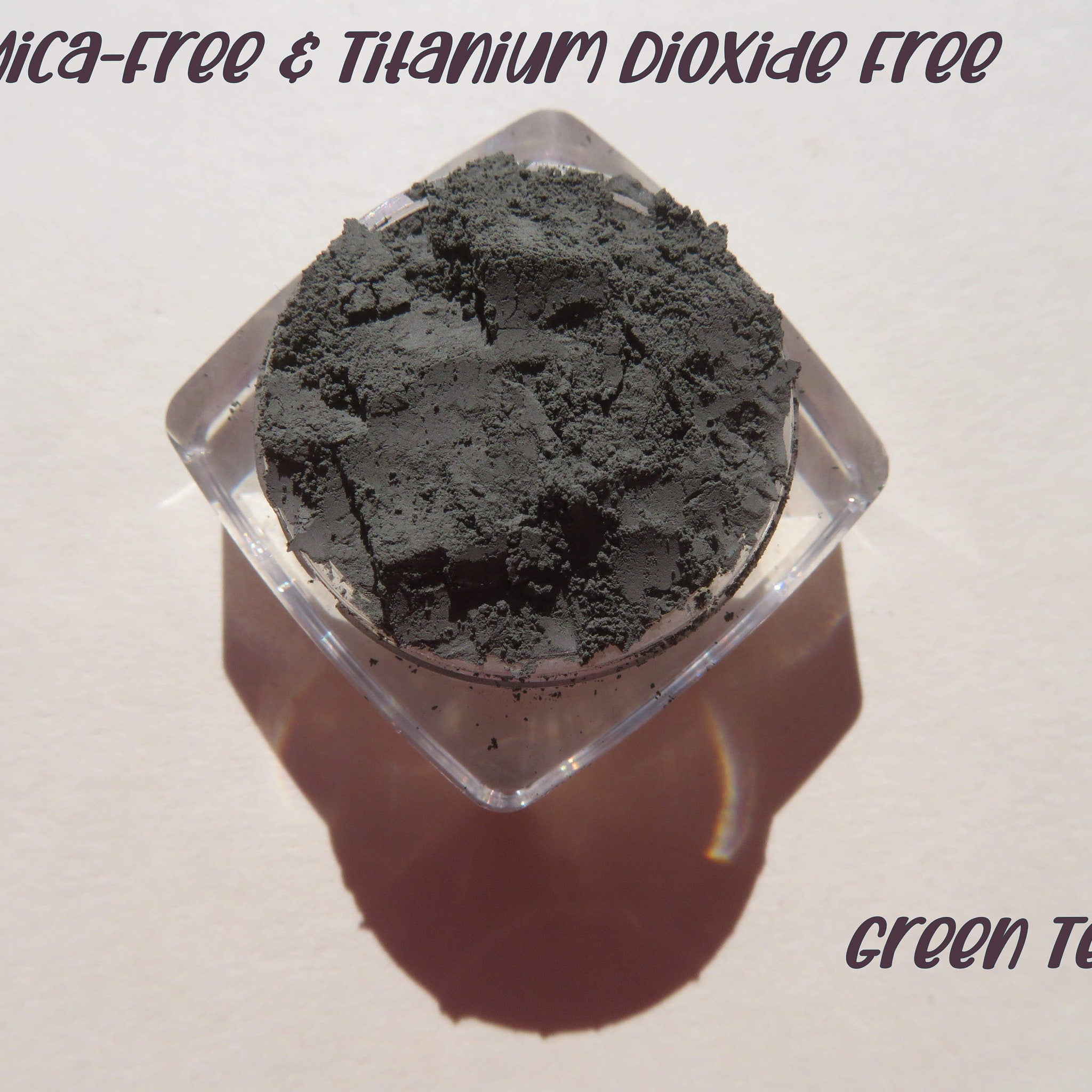 Dark matte green tea loose powder eyeshadow with mica shimmer in minimalist recyclable packaging