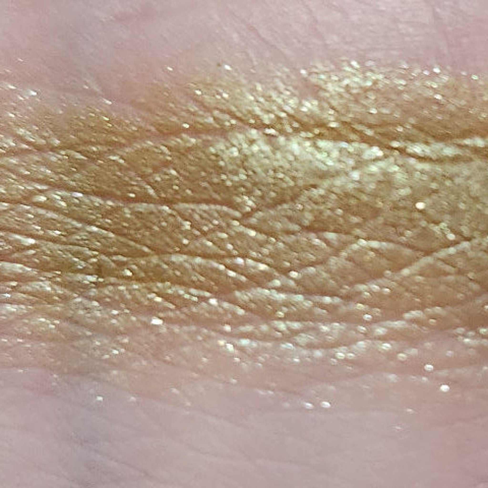 Side view of Eye of Newt Shadow Palette showcasing six matte and shimmer eyeshadows in earthy tones with embossed logo