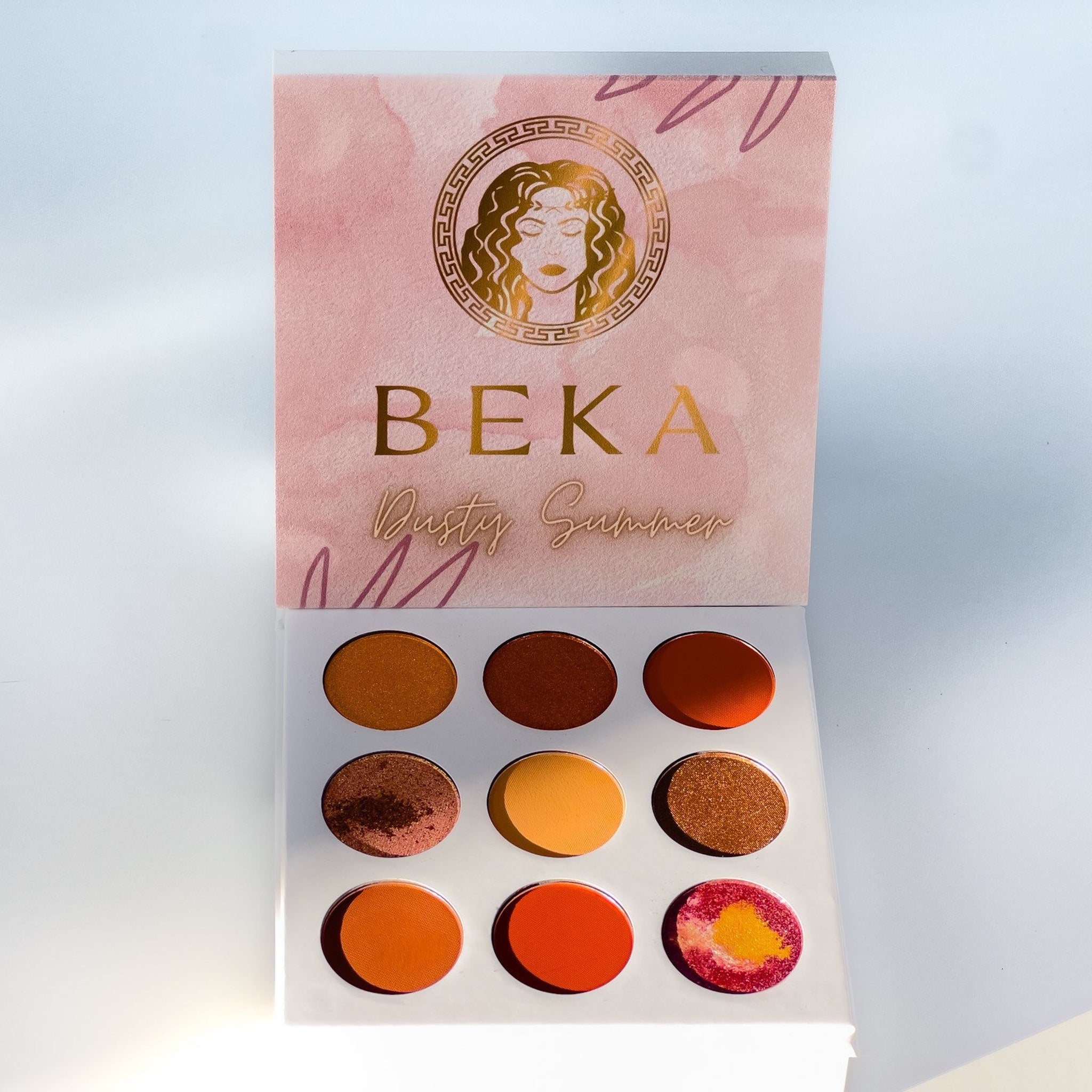 Close-up of Dusty Summer Eyeshadow Palette showing six matte and shimmer shades in warm terracotta and golden tones