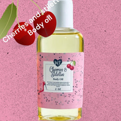 Body oil bottle with MT Cherries & Stilettos label, clear liquid, white cap, pink floral pattern background