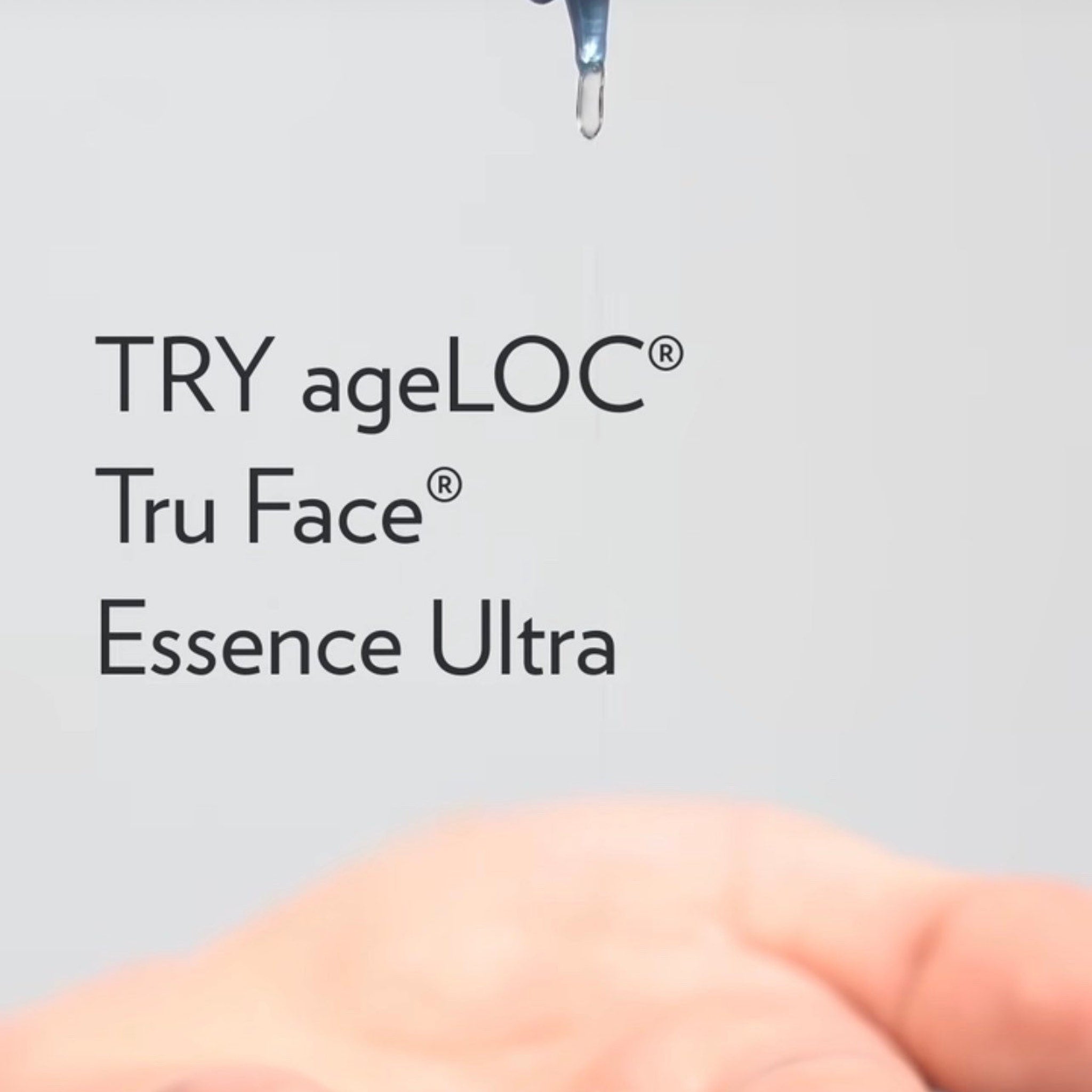ageLOC Tru Face Essence Ultra text on white background with liquid drop, hand visible