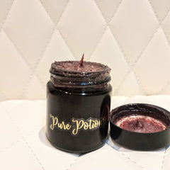 Facial Cleanser jar with dark purple scrub, black container, and Pure Potions logo