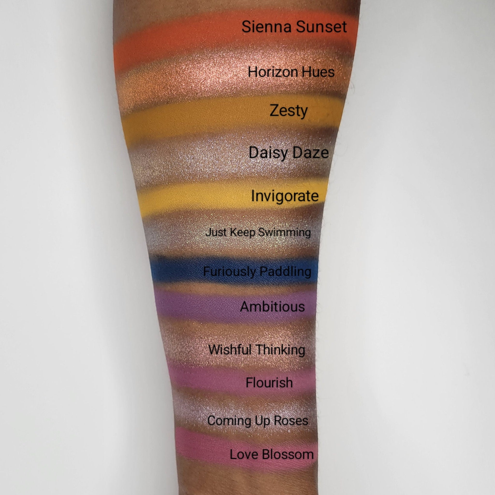 Side view of Fruitful End, Sweet Beginning Eye Shadow palette showing gradient of pink and gold hues