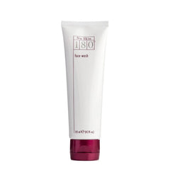 Face wash tube with white body, burgundy cap, and Nu Skin branding