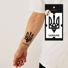 Close-up of two temporary Ukraine flag tattoos on skin, showcasing bold blue and yellow ink details