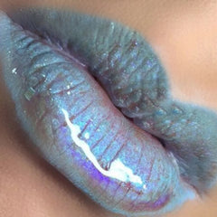 Lip makeup, holographic blue lip gloss with shimmer, close-up of lips