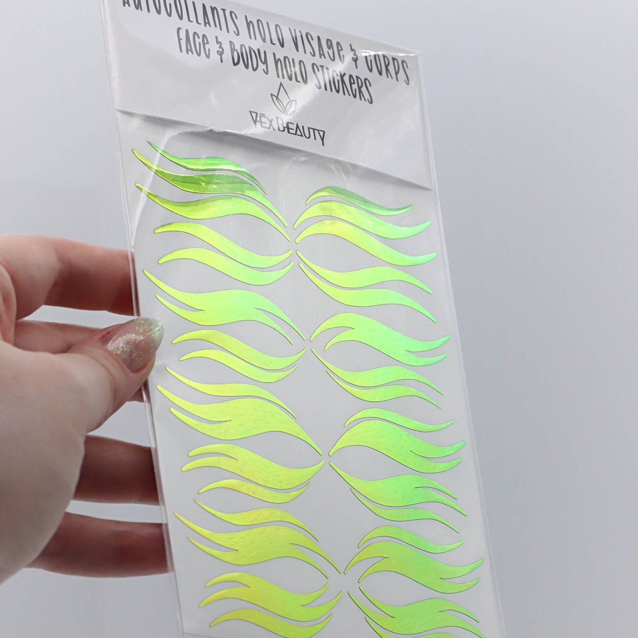 Holographic face stickers, green and yellow wave design, Vex Beauty brand packaging