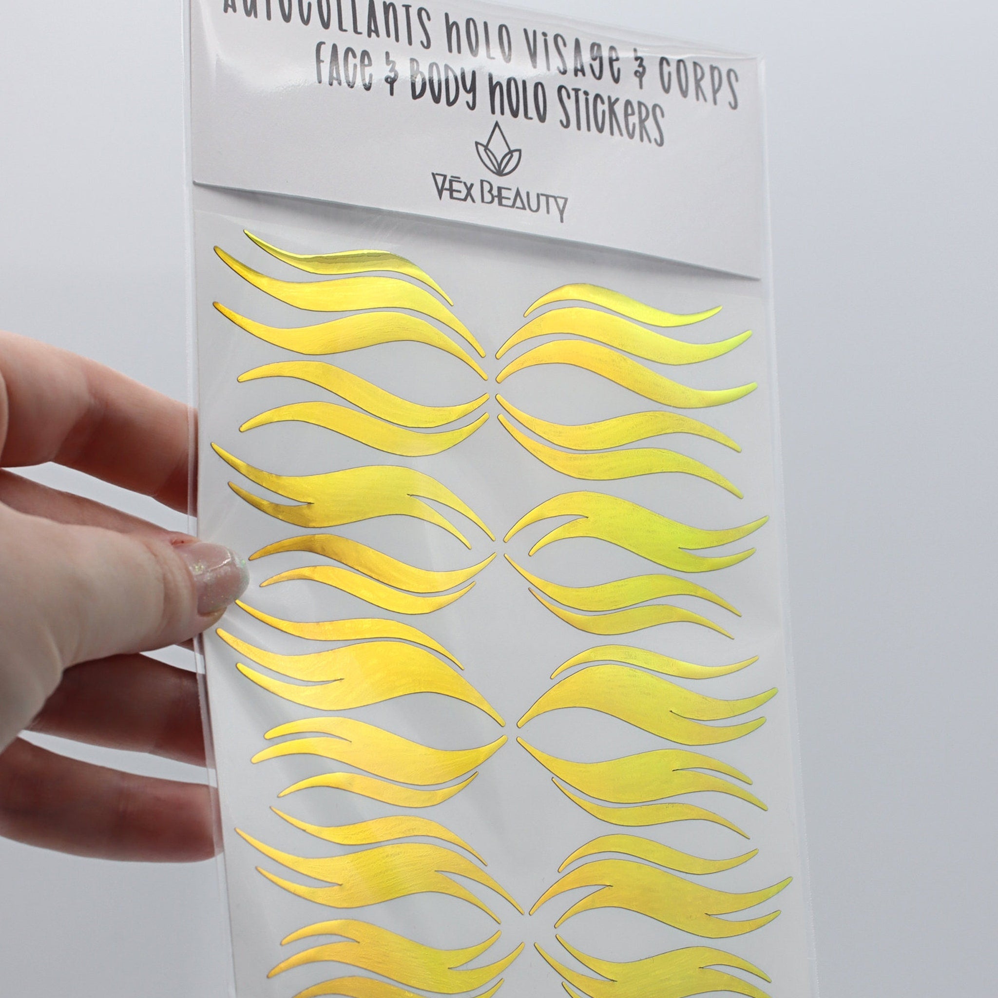 Holographic face stickers, gold wave design, Vex Beauty brand, face and body use