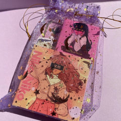 Hand applying shimmery pink eyeshadow from mini anime-inspired palette with fingertip