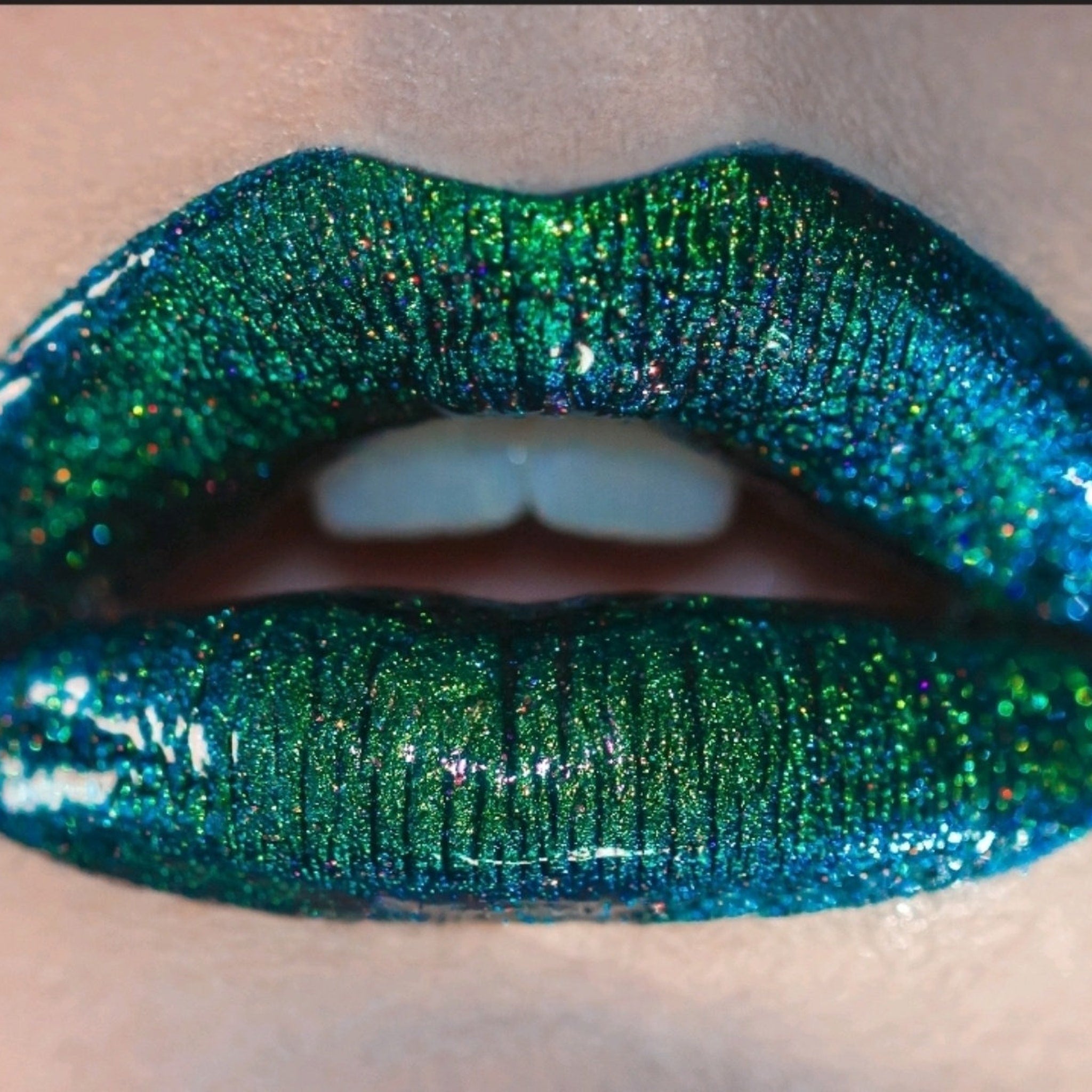 Close-up of loose multi-chrome eye shadow pigment showing shimmer particles catching light