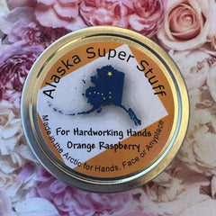 Dewy fingertips applying pearlescent serum to glowing cheekbone for radiant skin