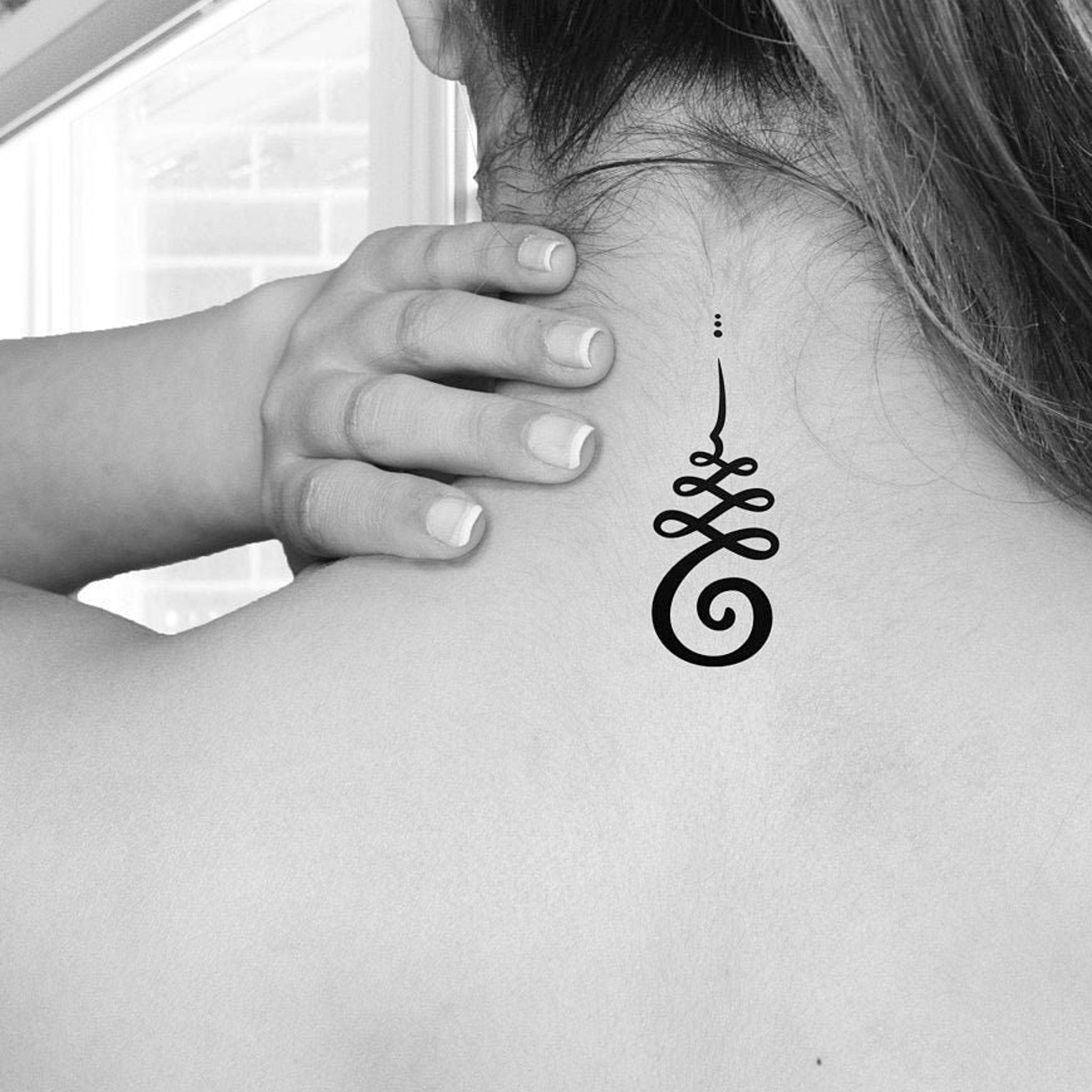 Set of three delicate unalome temp tattoos in gold foil packaging, skin-safe for radiant glow
