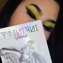 Side view of eye shadow palette showing sleek black compact with mirrored interior and vibrant color assortment