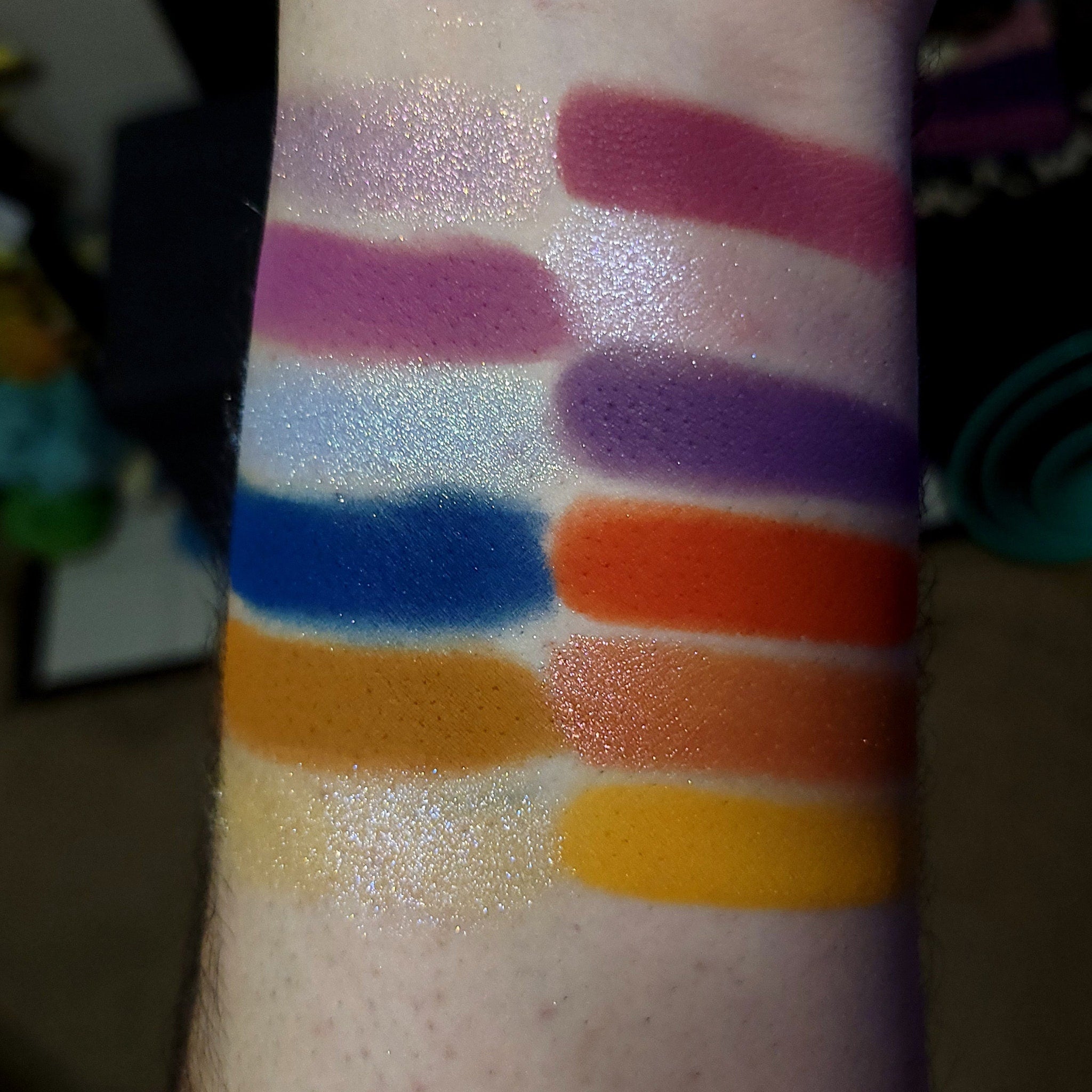 Close-up of shimmery peach and bronze eye shadow palette with smooth gradient blend