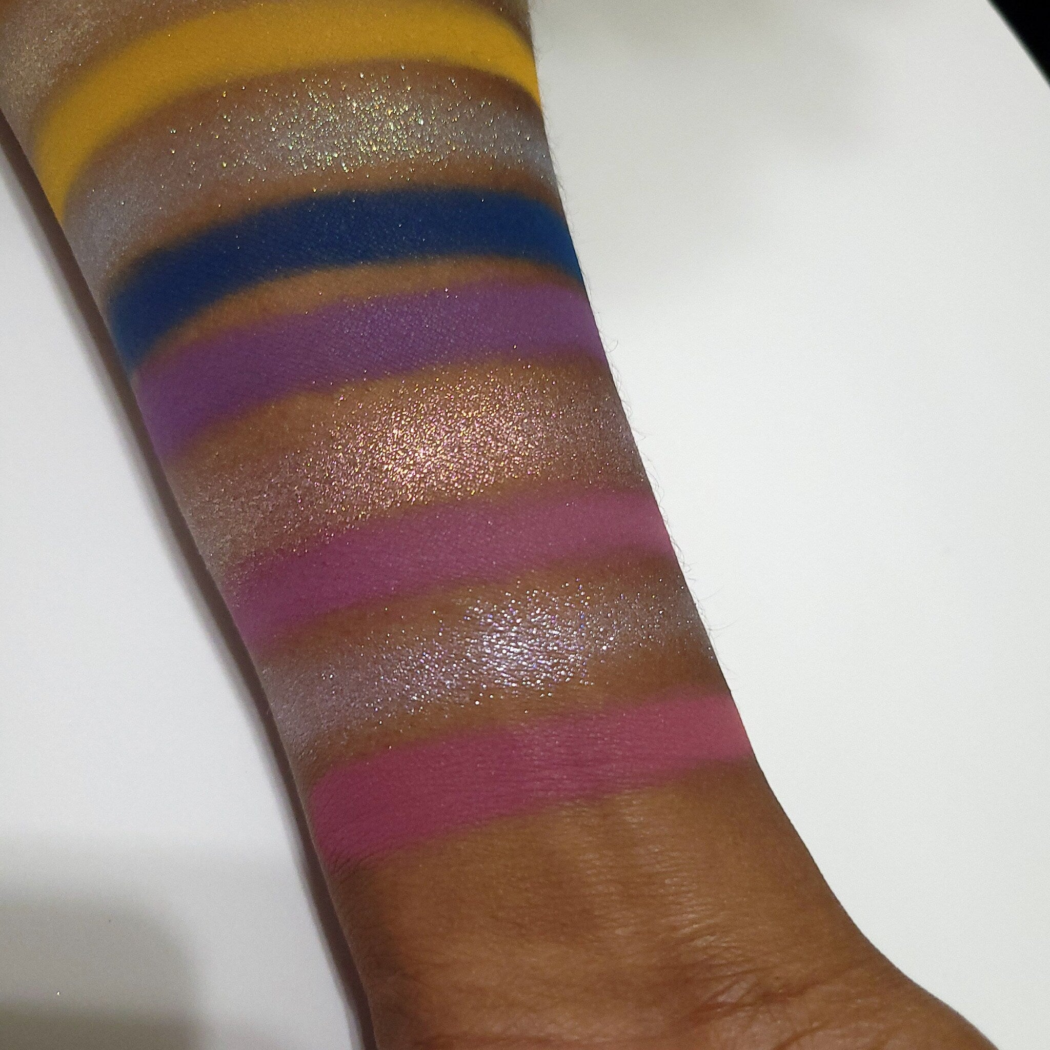 Close-up of Fruitful End, Sweet Beginning Eye Shadow palette showing bonus travel-sized brush included