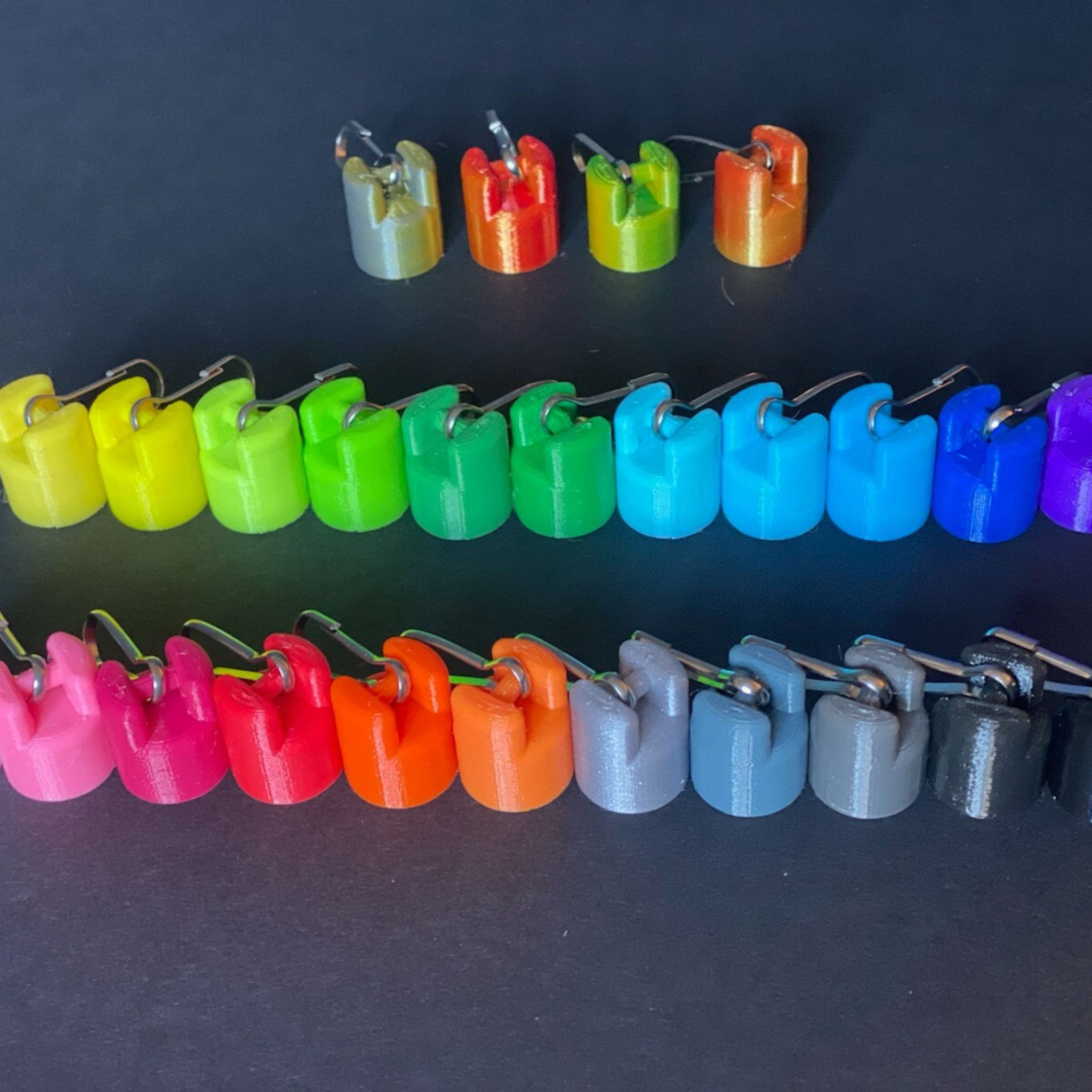 Colorful plastic clips with metal clasps, various colors and 3D printed style