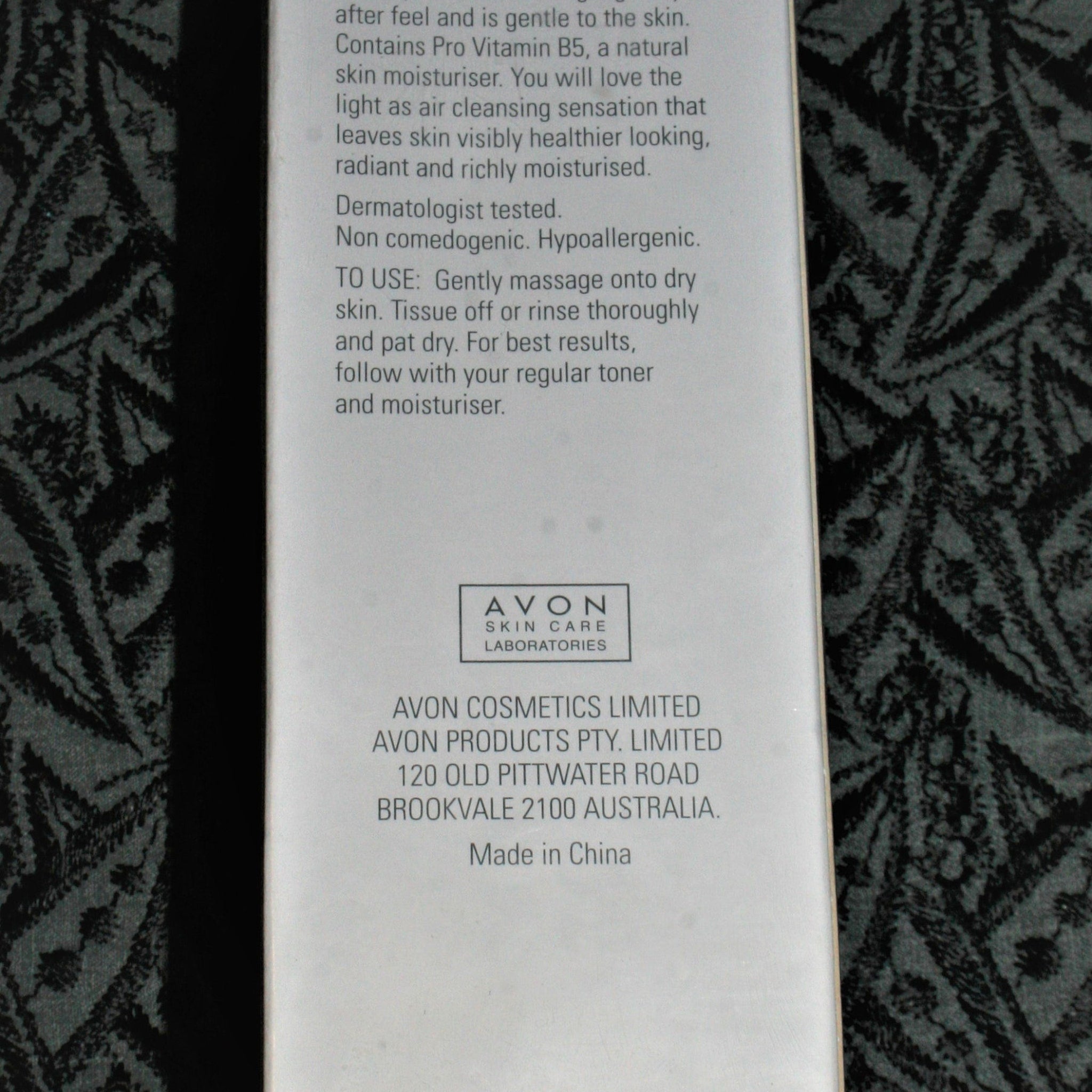 Avon Skin Care label, white background, black text, and patterned background.