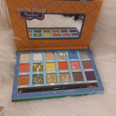 Close-up of Pawfect Eyes on Me palette showing six vibrant matte and shimmer eyeshadow shades in pet-inspired hues