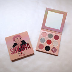 King of Curses eyeshadow palette featuring 12 vibrant matte and shimmer shades in jewel tones with black compact packaging
