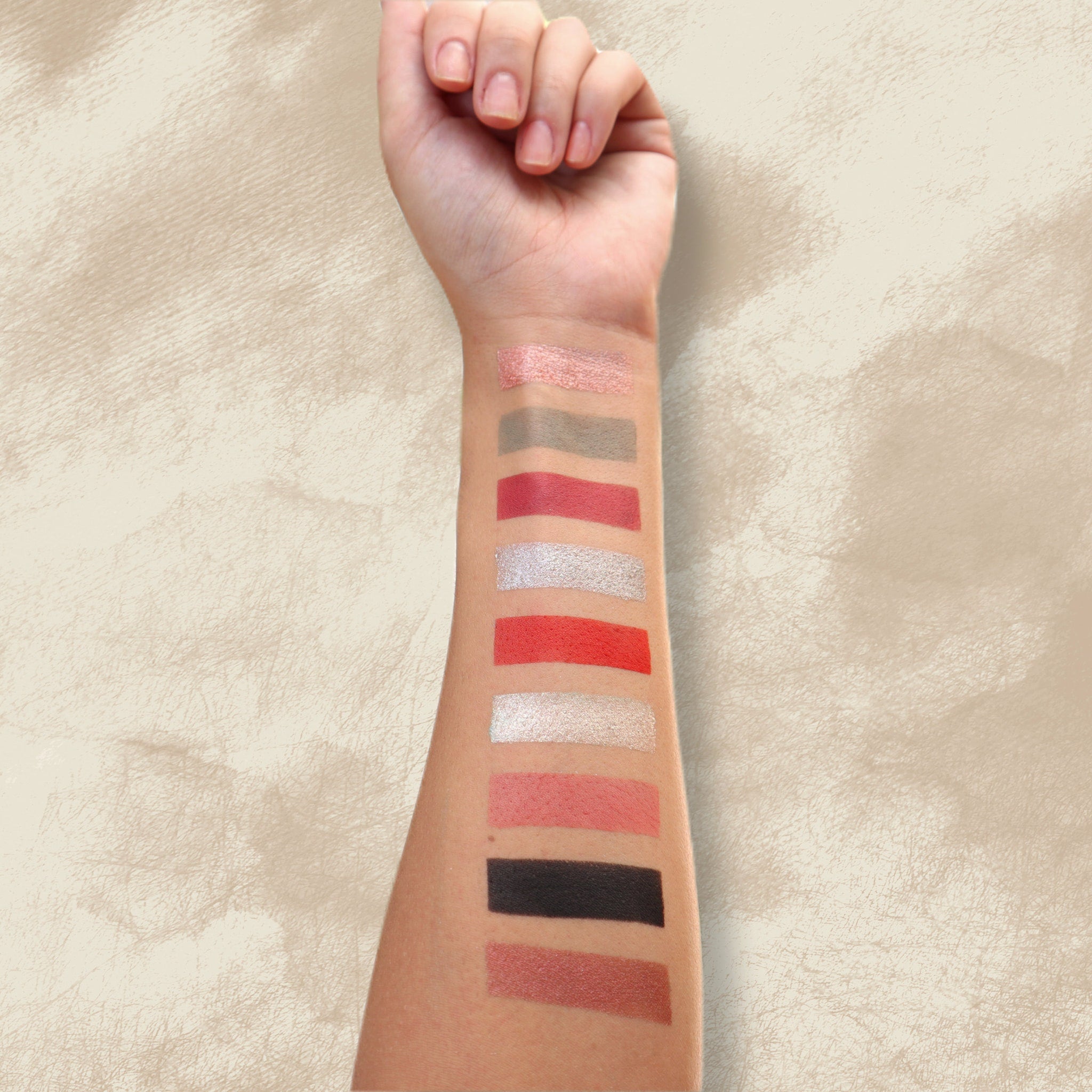 Close-up of King of Curses eyeshadow palette showing six vibrant matte and shimmery shades in jewel tones