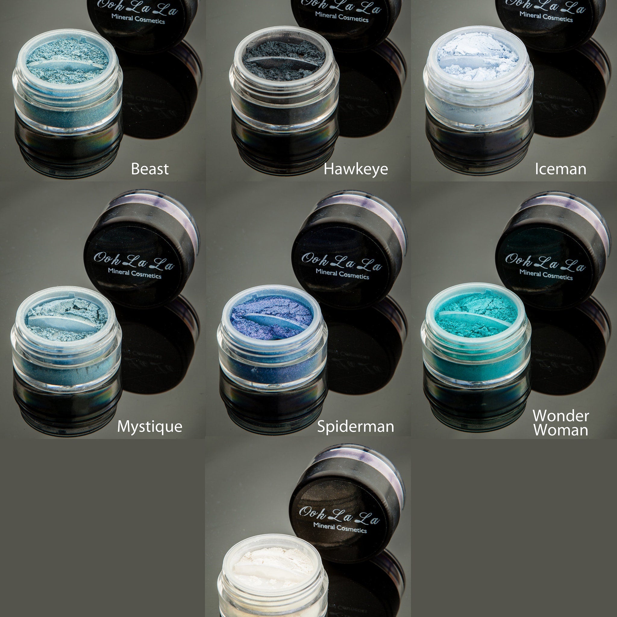 Close-up of mineral eye shadow powder in a small glass jar showing its finely milled texture and rich pigment