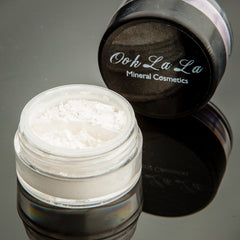 Side view of white, silver, and black mineral eye shadow in a 10g jar with matte finish and vegan label