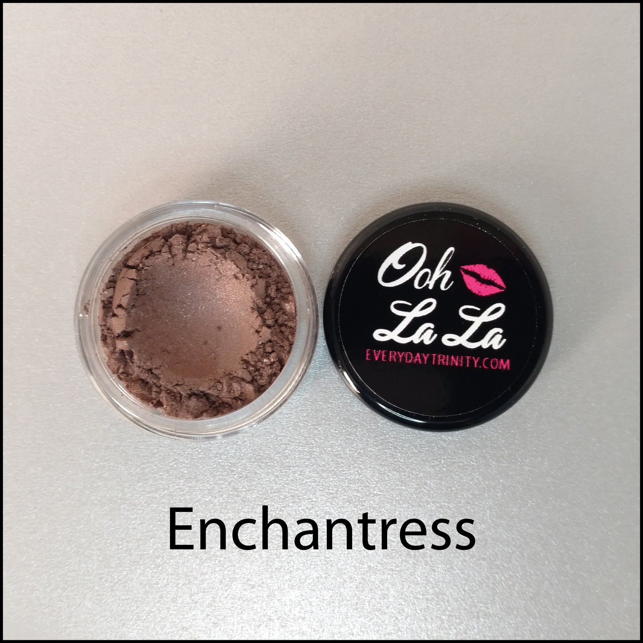 Hand applying soft brown mineral eye shadow with a brush for a natural daytime look