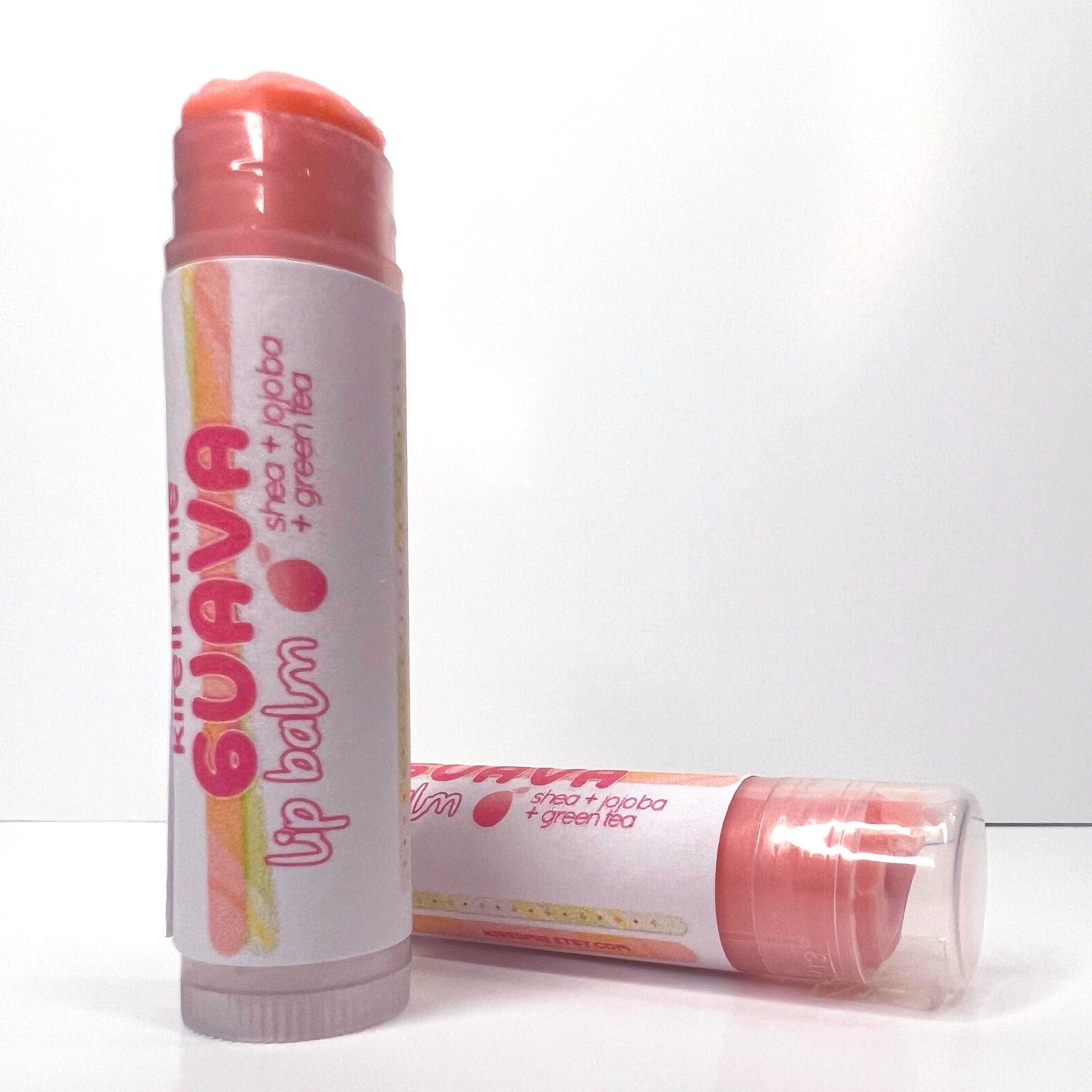 Lip balm tubes with pink color, white label, and "Guava" text on packaging