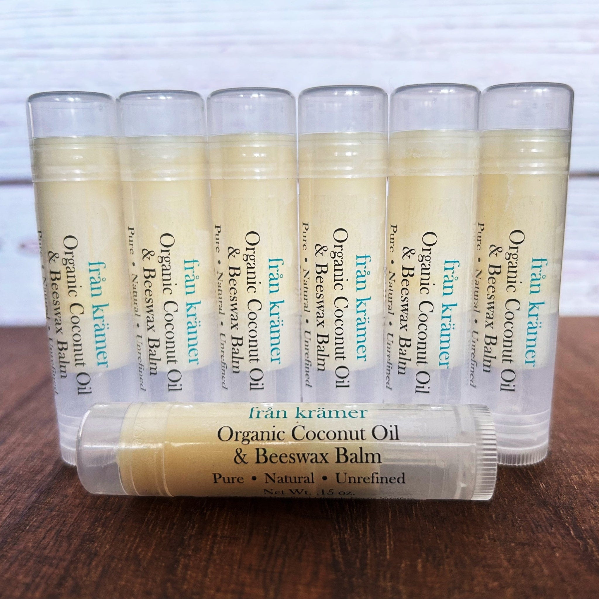 Lip balm tubes with clear plastic, light yellow balm, and "från krämer" branding on label