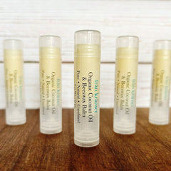 Lip balm tubes with clear plastic caps, yellow balm, and "från krämer" text on white labels