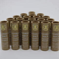Lip balm tubes in brown paper packaging with gold text, "GLEAM & GLOW" brand name visible