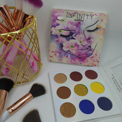 Side view of eye shadow palette showcasing matte and shimmer shades in warm bronze tones