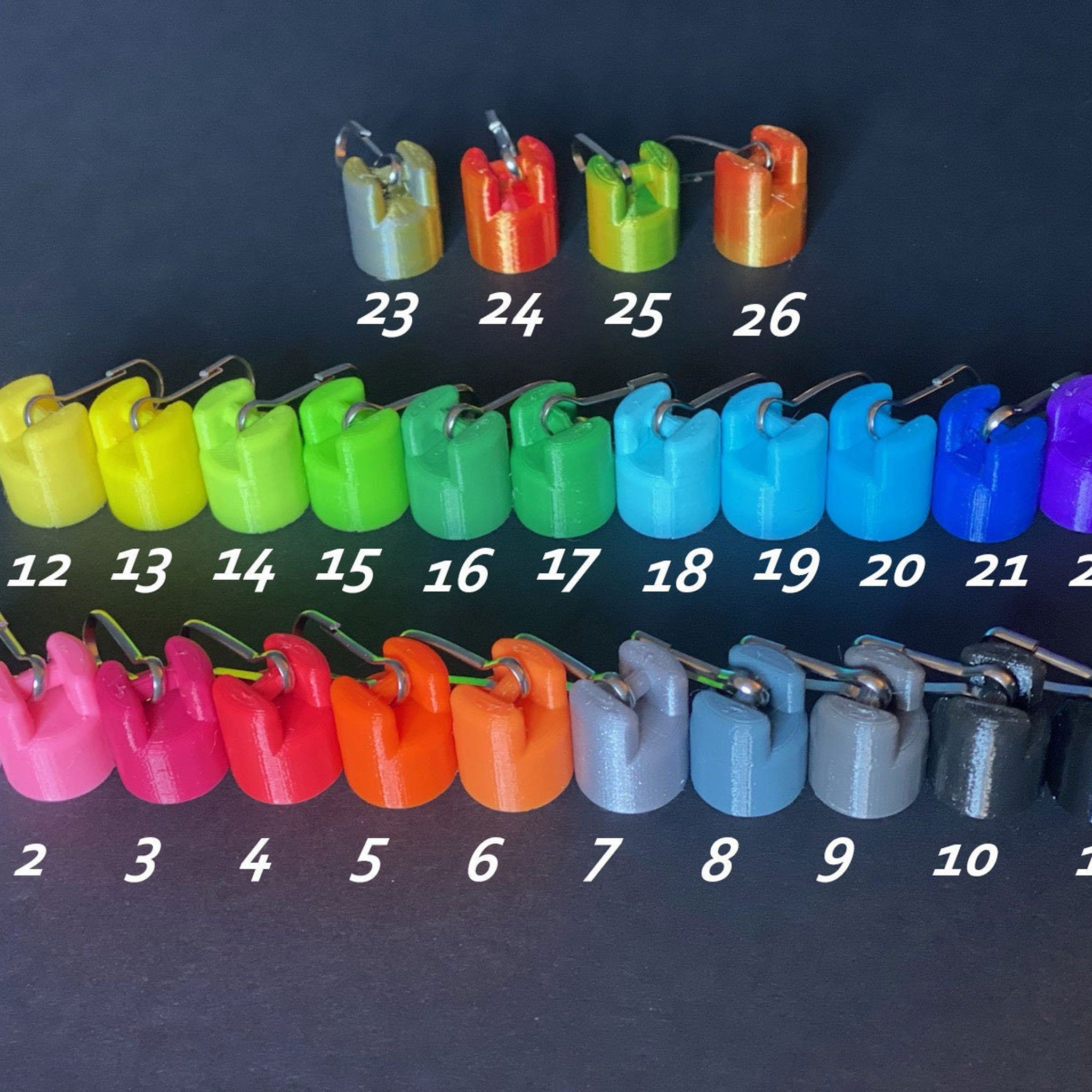 Colored plastic clips with silver hardware in various colors, numbered 2 through 26