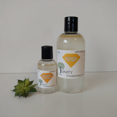 Facial toner bottles, clear liquid, black caps, with Trinity label, for skincare
