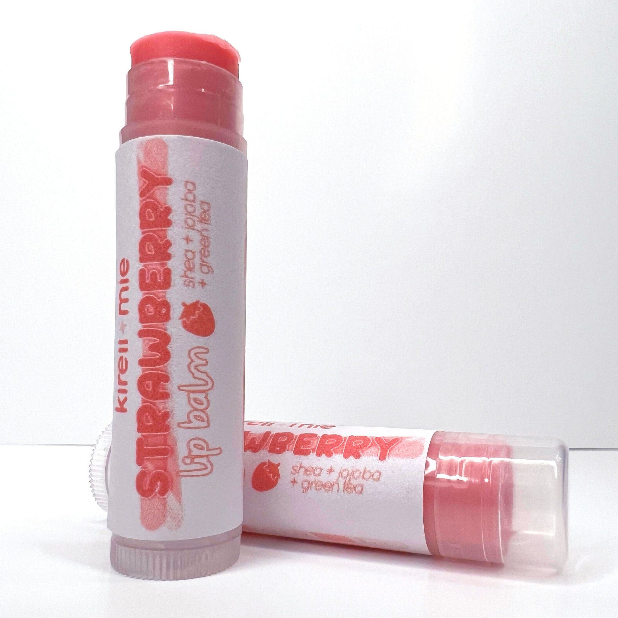 Lip balm with red and white packaging, Kireiimie Strawberry lip balm, two tubes shown