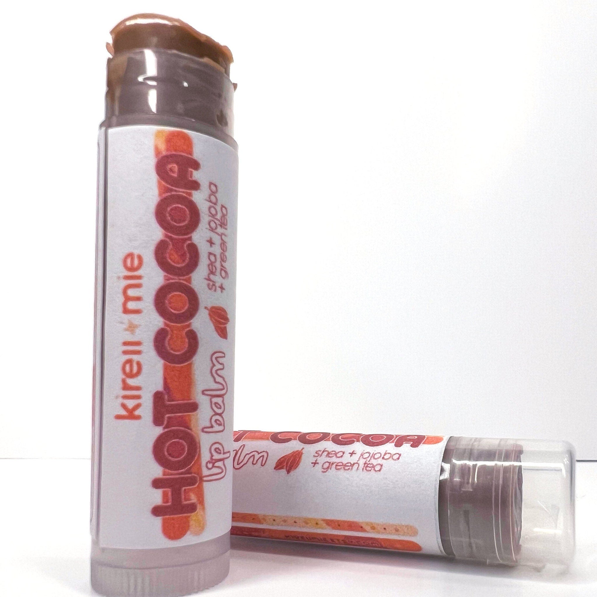 Lip balm tubes with brown balm, white label, and Kireiimie Hot Cocoa text