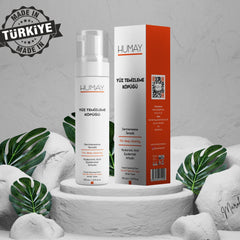 Facial cleanser foam bottle and box, white and orange packaging, brand HUMAY visible