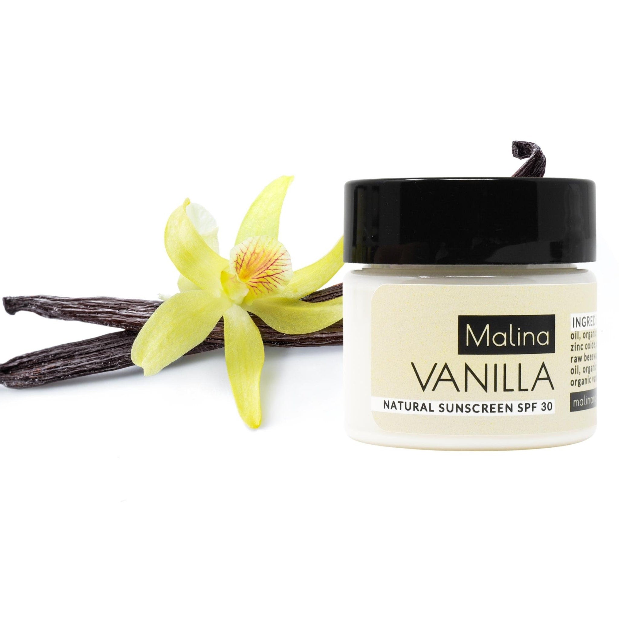Vanilla sunscreen jar with black cap, white label, and vanilla bean and flower accents