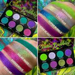 Hand applying shimmery teal eyeshadow from Cosmic Bubbles palette with fingertip