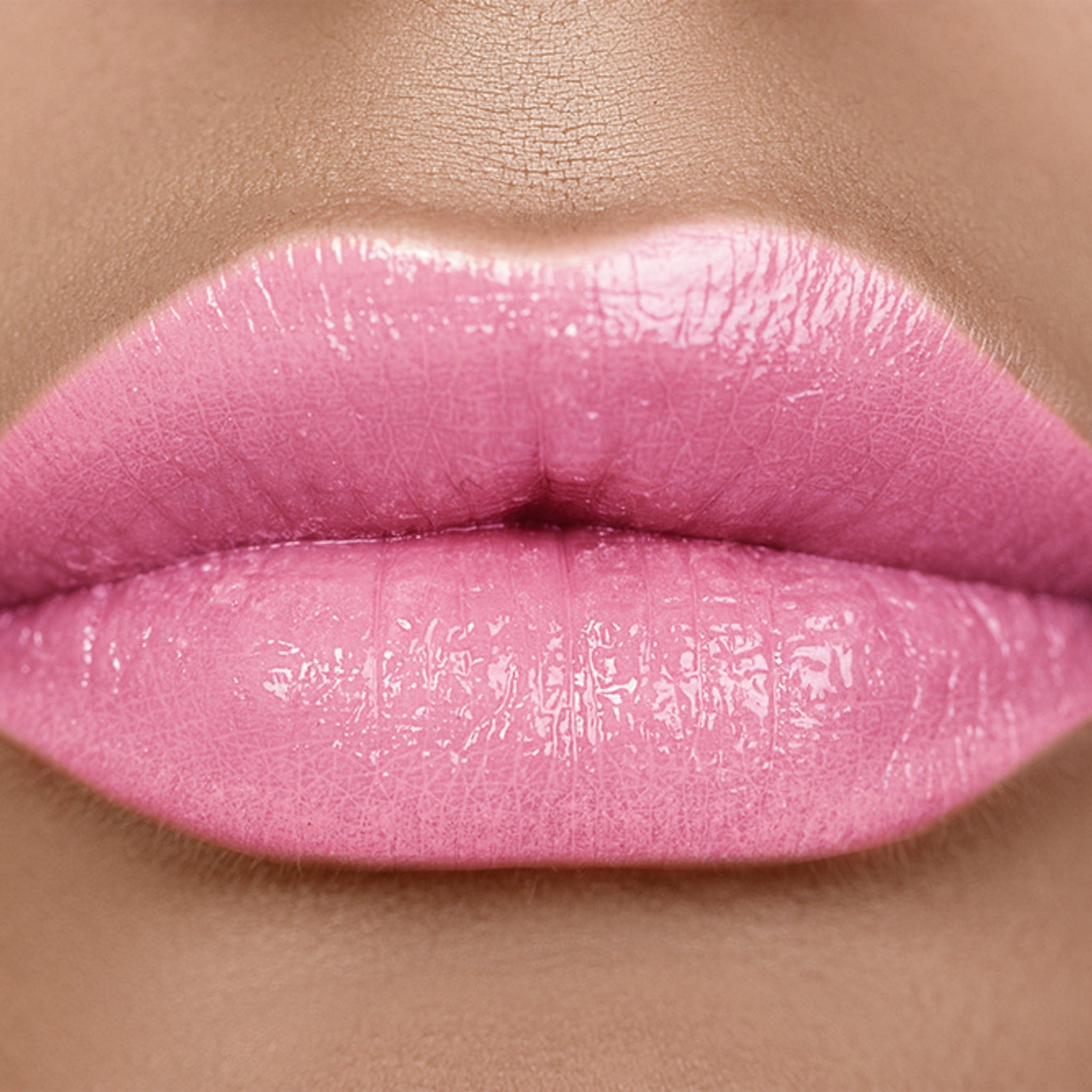 Lip gloss, pink glossy lips with visible texture and skin tone detail