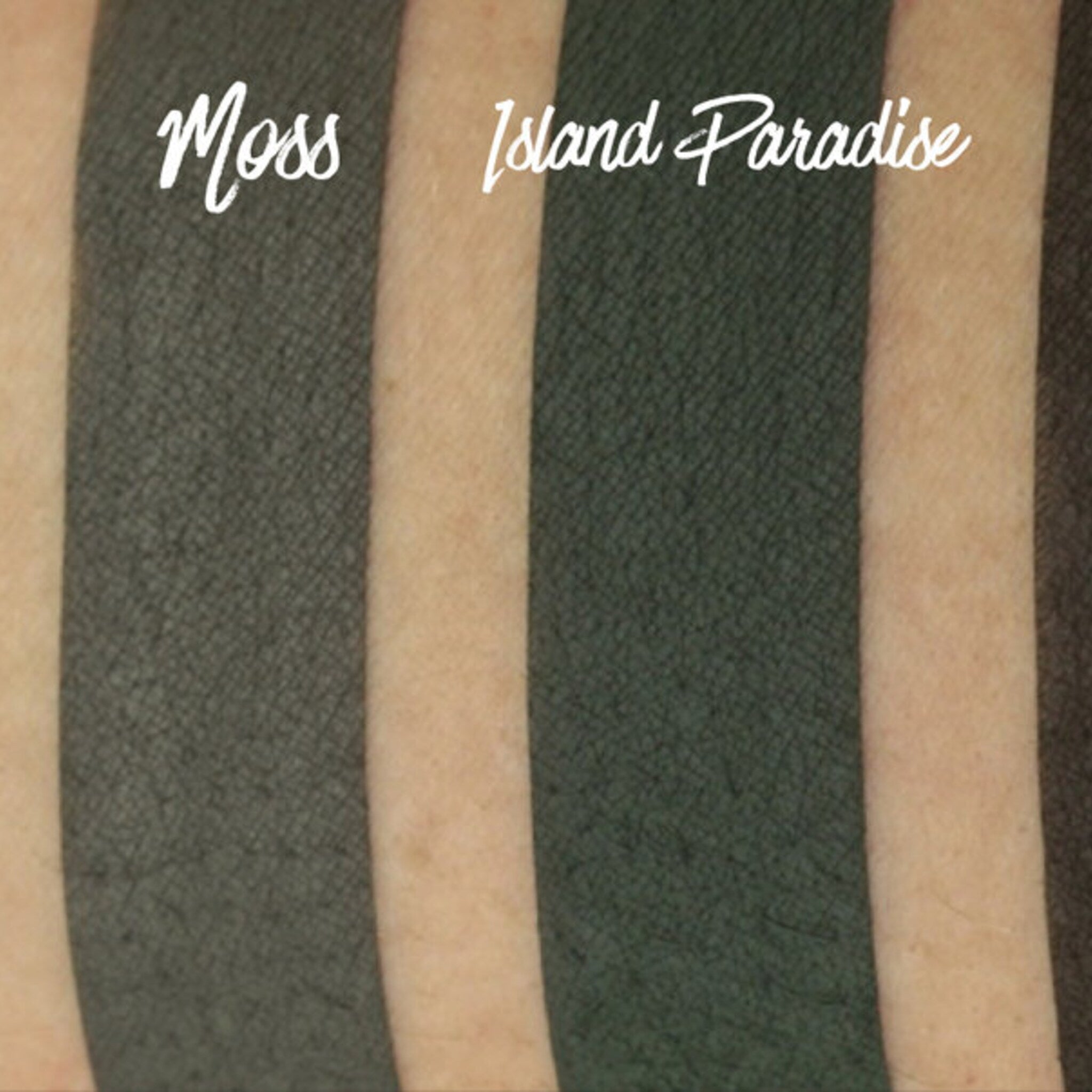 Close-up of fingertips applying matte peach eyeshadow to eyelid with blending brush