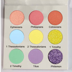Side view of Colorful Bible Eye Shadow Palette showcasing shimmering jewel-toned shades in rectangular pans