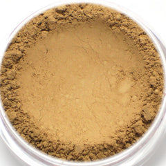 Powder makeup, tan powder with a rough texture, in a clear plastic container