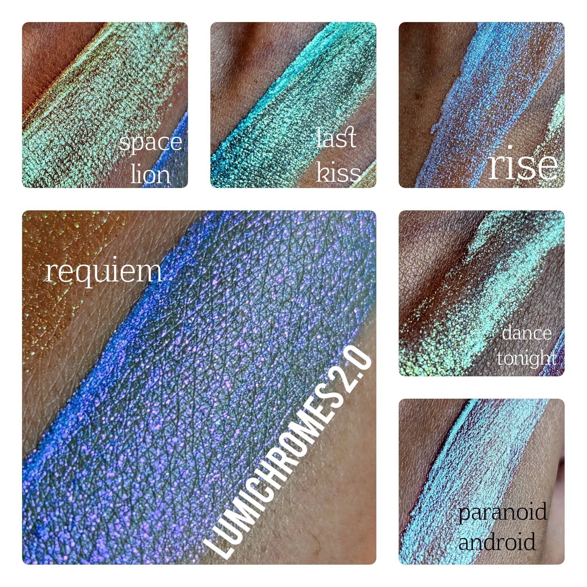 Makeup swatches with shimmering blue, green, and purple hues, LUMICHROMES 2.0 brand visible