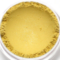 Side view of shimmery pale yellow vegan mineral eyeshadow in compact with gold detailing.
