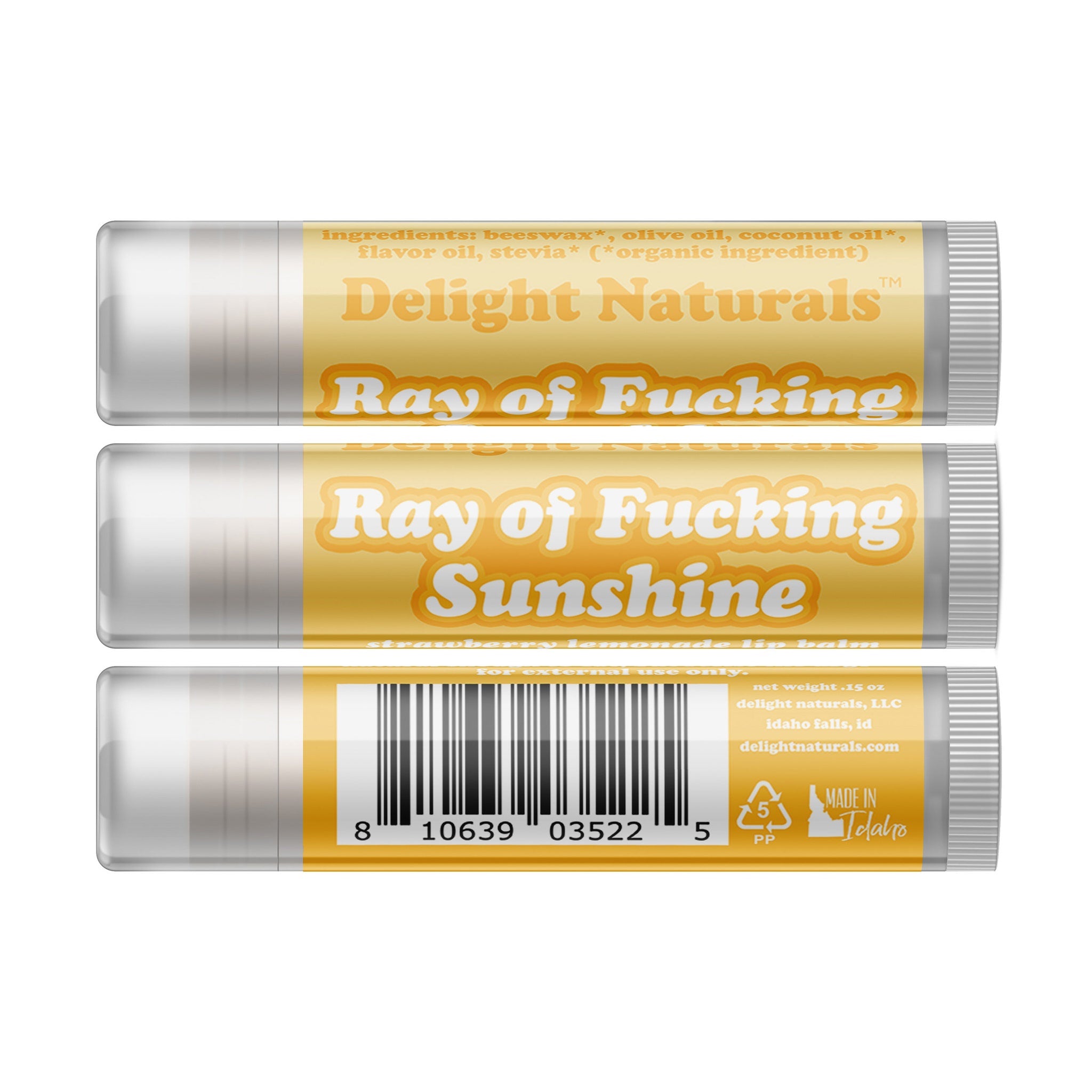 Lip balm tubes with yellow and white labels, Delight Naturals branding, and black barcode