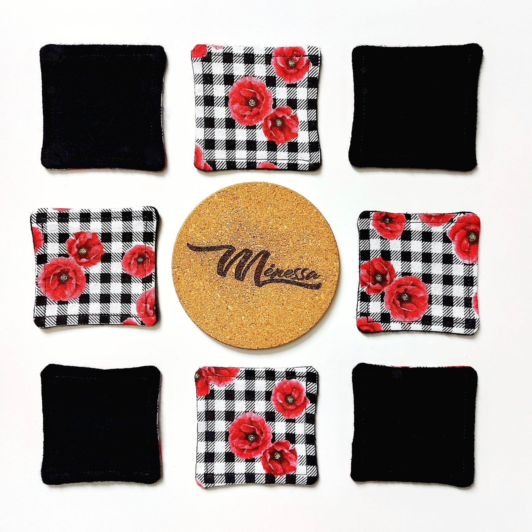 Coasters with black and white gingham pattern and red floral design, with black coasters