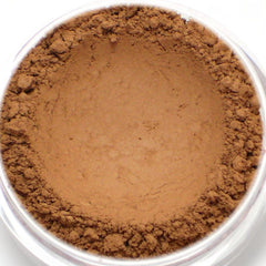 Powder makeup, brown, loose, granular texture, in clear container